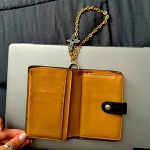 Louis Vuitton - Black and gold small wallet/ wristlet with change purse.